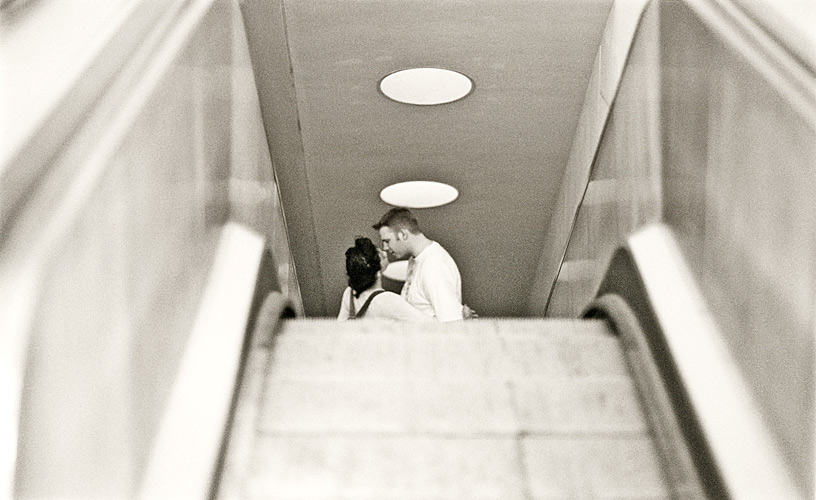 Lovers on escalator, Waterloo Station, London