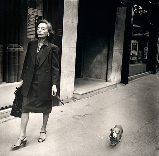 Woman walking dachshund, Paris